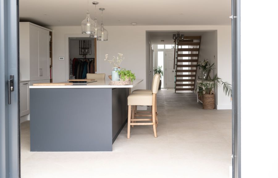 SWOOP-BEIGE-KITCHEN-3. Image shows beige tiles on kitchen floor with blue cabinetry