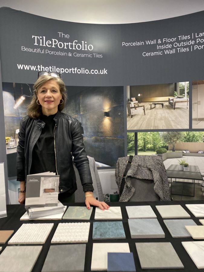 chamber. Image shows company owner with tile samples at an exhibition