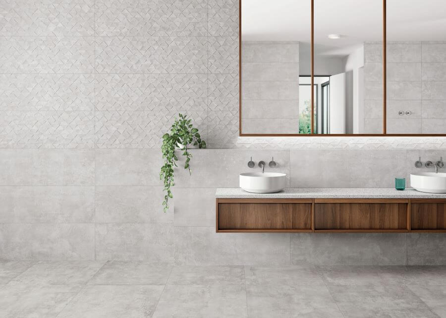 BEAT-GREY-CEMENT-LOOK-PORCELAIN-TILE-BATHROOM. Image shows bathroom with grey tiles and wood vanity unit