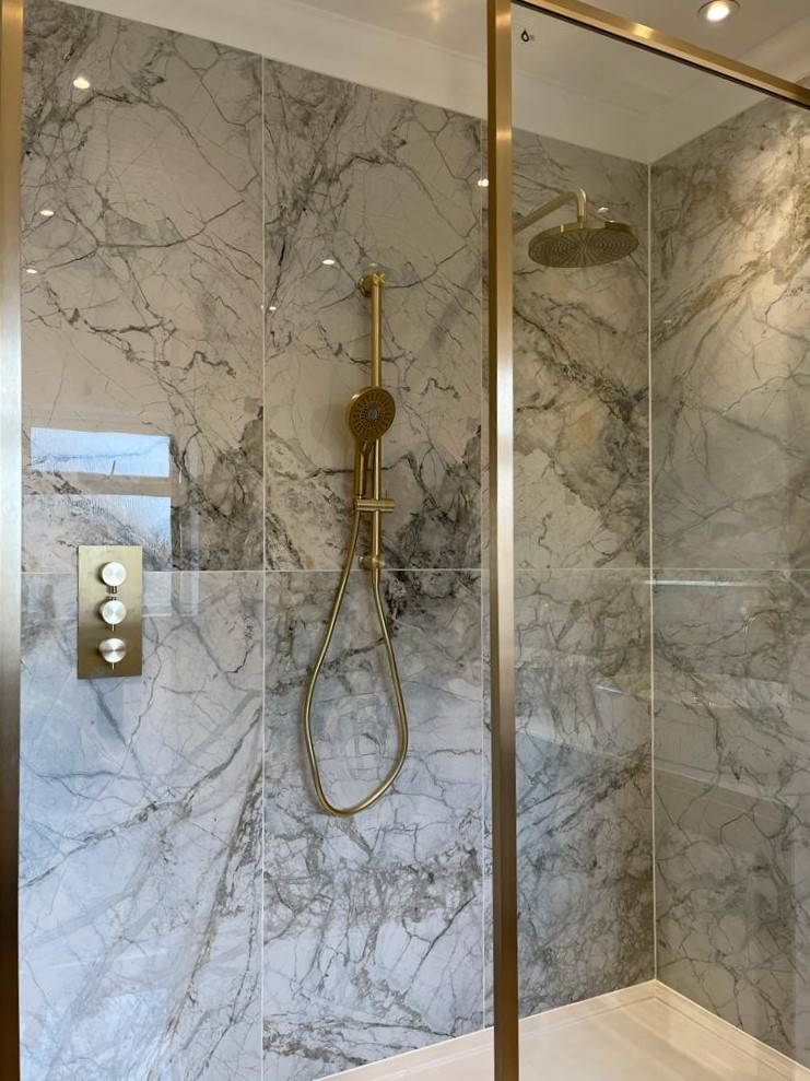 BELLEZA-WHITE. Image shows polished marble tiles in a shower