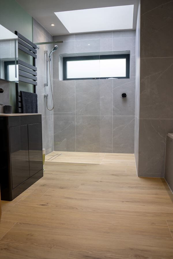 Test Blog - image shows, light grey ceramic tiles in a large shower