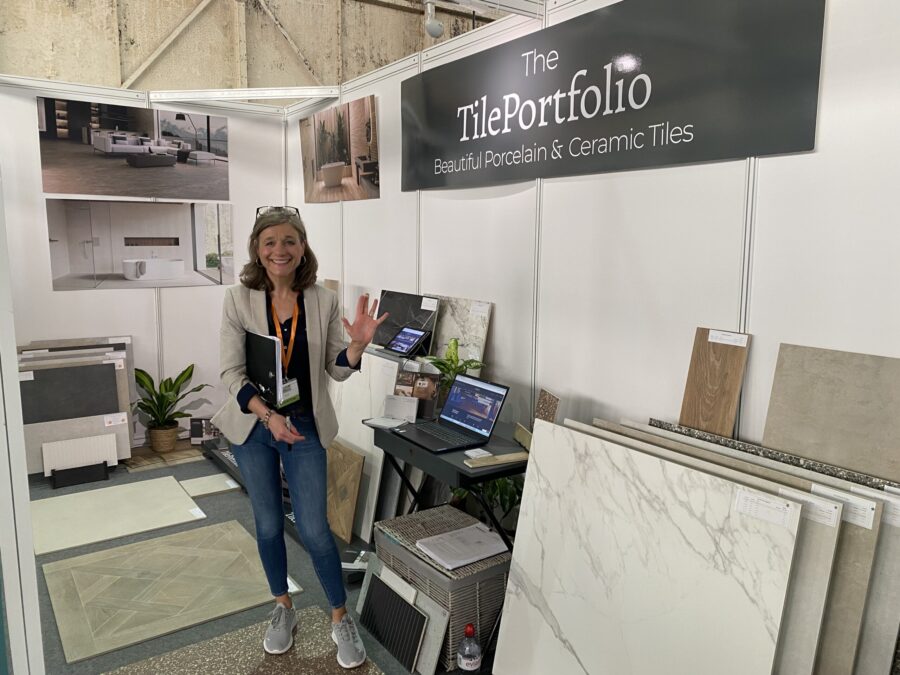 BICESTER-SHOW. Image shows lady waiving on exhibition stand surrounded by tiles