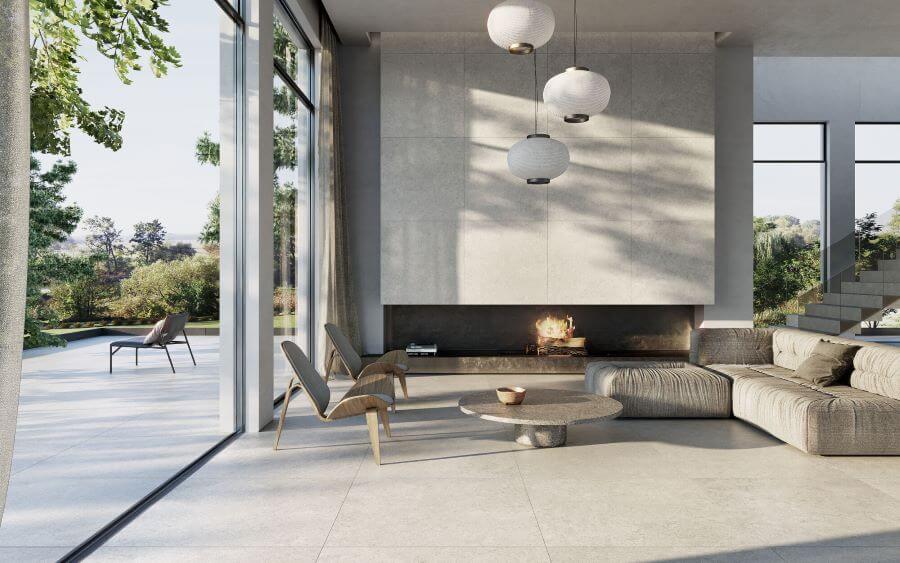 CHIC-LIMESTONE-PORCELAIN-FLOOR-TILE-SAND-1. Image shows limestone porcelain floor tile in lounge with sofa and chairs