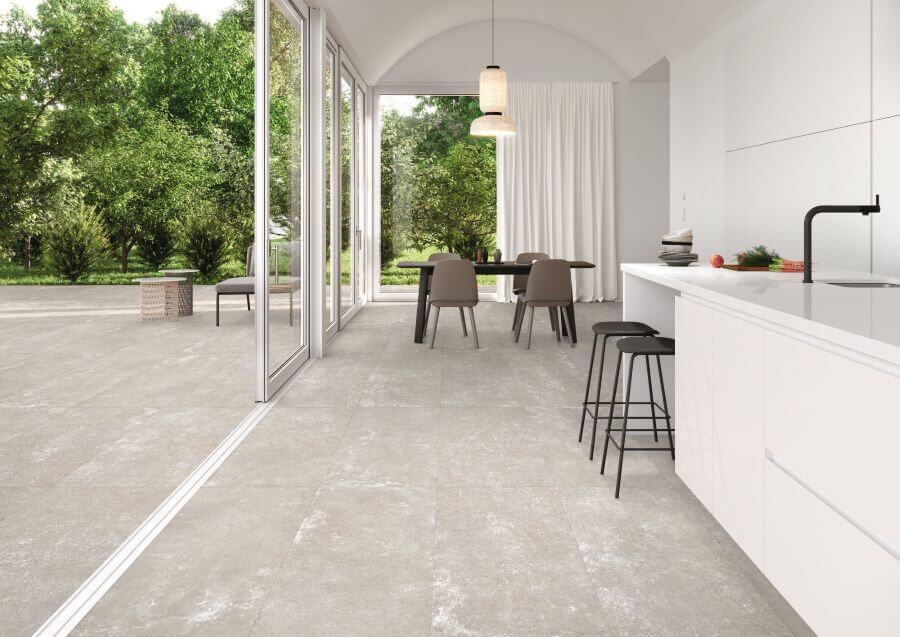 DOCKLANDS-CEMENT-PORCELAIN-TILES-BEIGE. Image shows beige cement porcelain tiles in open plan area and outside