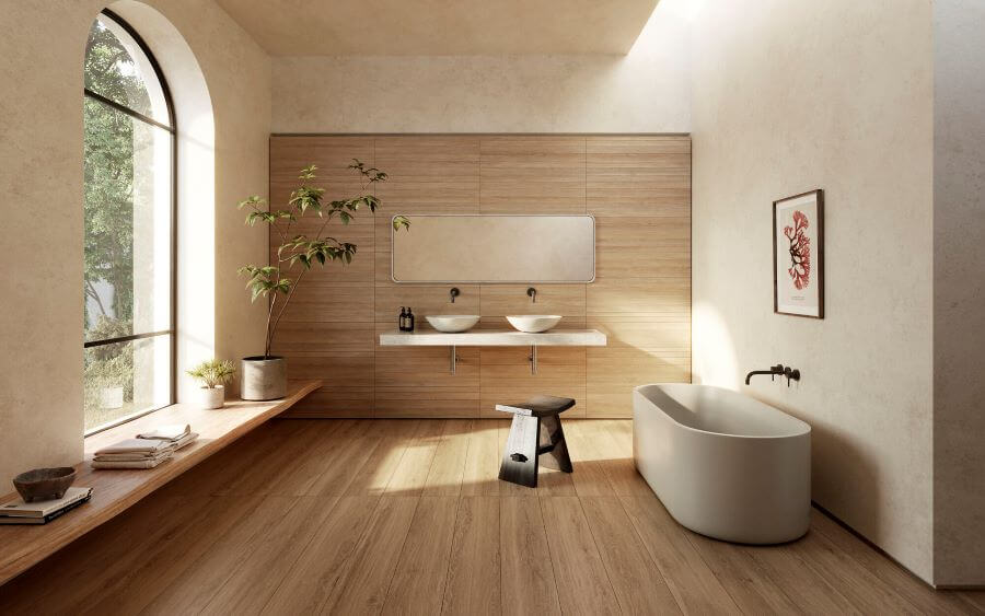 PORCELAIN-BATHROOM-TILES-KNOT-HONEY. Image shows porcelain bathroom tiles in Honey with bath and stool