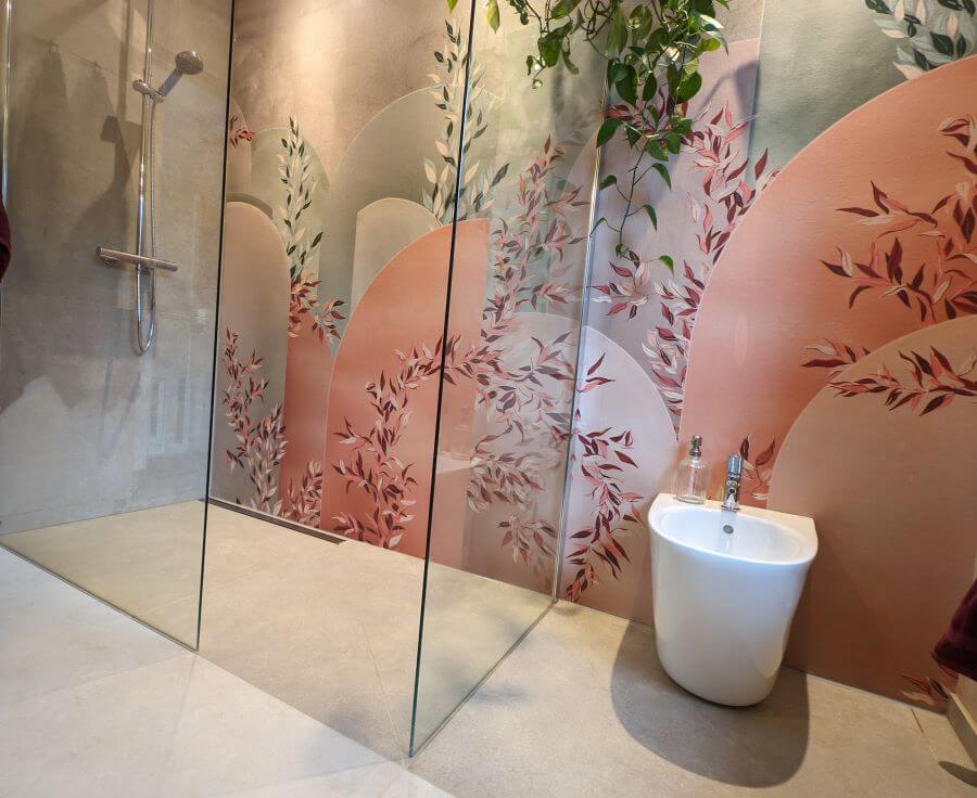 A-ROOM-IN-THE-GARDEN. Image shows floral waterproof wall paper in shower area with beige tiles to floor and bidet