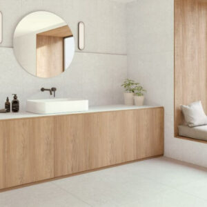 Abode White. Image shows white limestone porcelain tile in bathroom with window seat