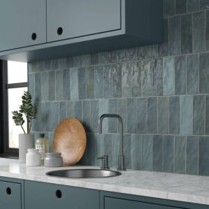 Adore Aqua. Image shows blue ceramic Spanish tile in kitchen as splashback with sink and worksurface