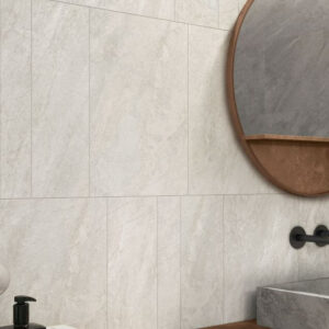 ALPINE-CHAMPAGNE-QUARTZ-EFFECT-PORCELAIN-TILE. Image shows white quartz effect porcelain tile on bathroom wall with mirror