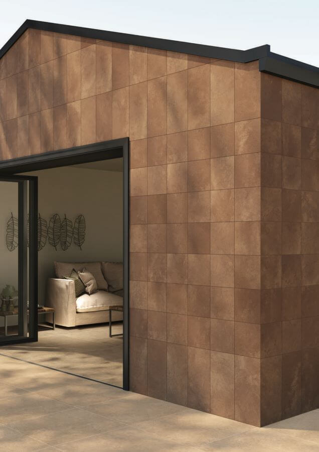 ARTISAN-BRICK-CONCRETE-LOOKING-TILES. Image shows brick coloured concrete looking tiles cladding an outside building