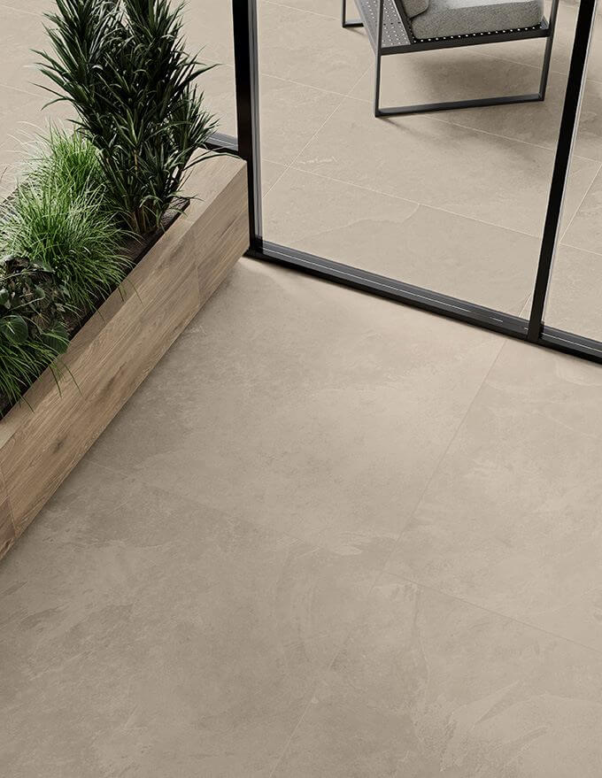 Aspect Ash. Image shows porcelain tile that looks like slate inside and outside with bifold doors