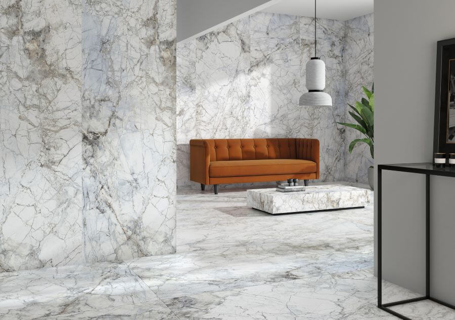 Belleza White. Image shows white marble effect tile in lounge