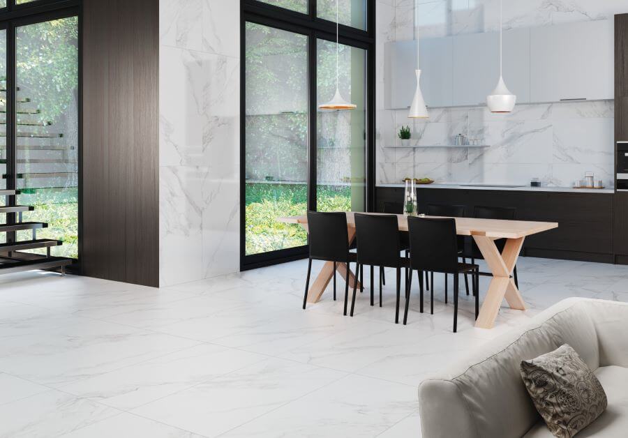 CARERRA-ARGENT-LARGE-FORMAT-MARBLE-TILE. Image shows large format marble porcelain tile with grey veining with kitchen and dining.