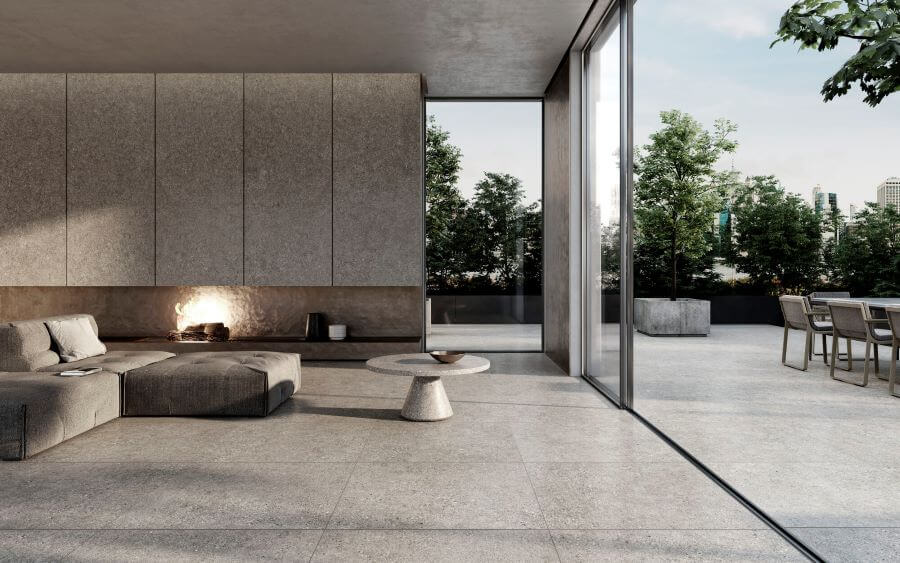 DEFINE-SILVER-TERRAZZO-EFFECT-PORCELAIN-TILE-LOUNGE. Image shows silver terrazzo effect porcelain tile to lounge floor and onto patio