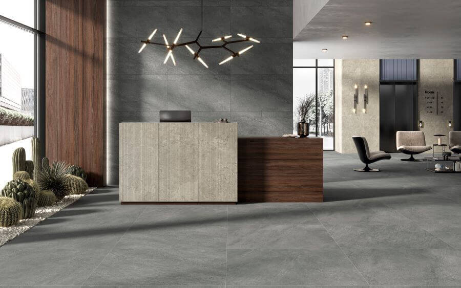 ETHOS-FLINT-STONE-LOOK-PORCELAIN-TILE. Image shows dark grey stone look porcelain tile in reception area