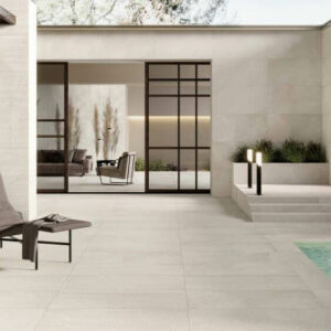 Ethos Shore. Image shows cream stone look porcelain tile around a pool