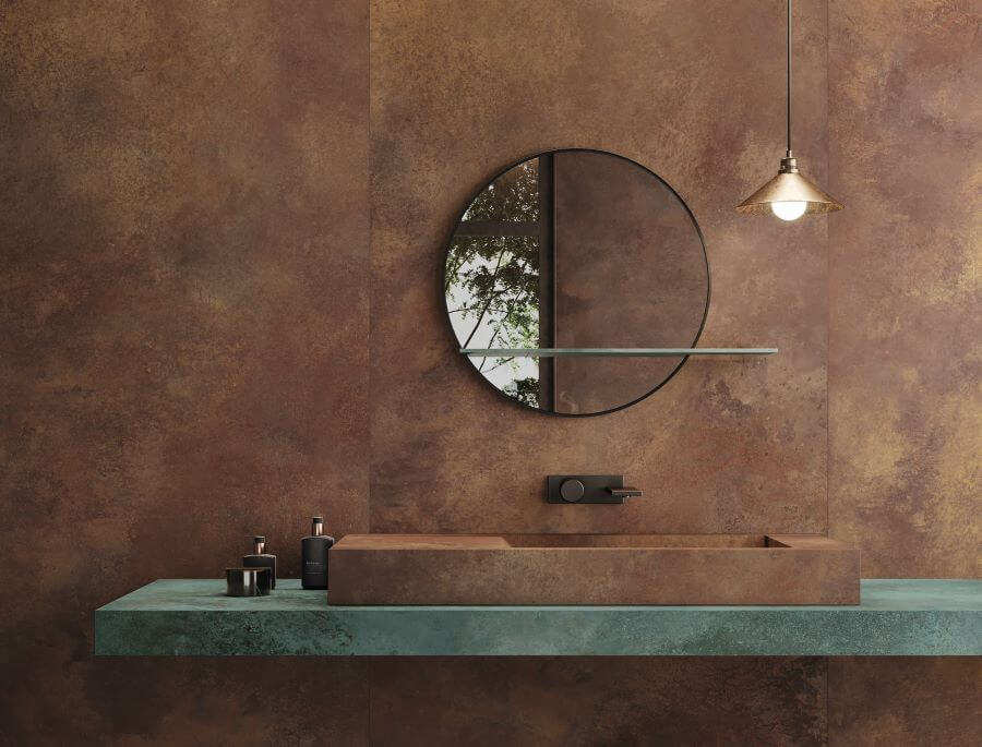 FORGE-BRONZE-PORCELAIN-METALLIC-BATHROOM-TILES-CLOSEUP. Image shows bronze metallic tiles on wall and sink with mint vanity unit