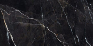 MARQUINA-ORO-MARBLE-EFFECT-PORCELAIN-TILE. Image shows black marble tile swatch with gold and grey veins