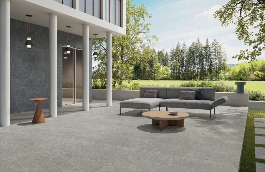 POISE-SILVER-STONE-LOOK-PORCELAIN-TILES. Image shows silver stone look porcelain tiles on patio