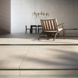 TONE-ECRU-2CM-OUTSIDE-PORCELAIN-PAVER. Image shows ecru 2cm outside porcelain paver next to a pool