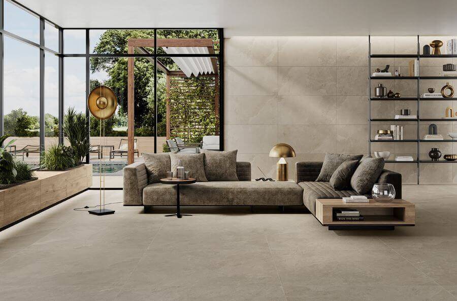 ASPECT-ASH-PORCELAIN-TILE-THAT-LOOKS-LIKE-SLATE. Image shows ash porcelain tile that looks like slate in lounge with sofa and shelving units