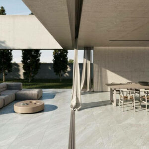 GRACE-PEARL-STONE-LOOK-TILES. Image shows light grey stone look tiles outside and inside a home