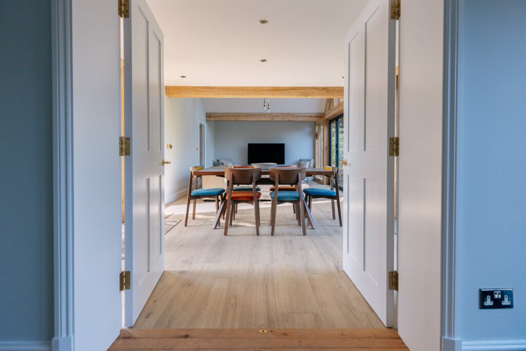 SERENITY-WHEAT. Image shows light oak tile in dining area with table and chairs