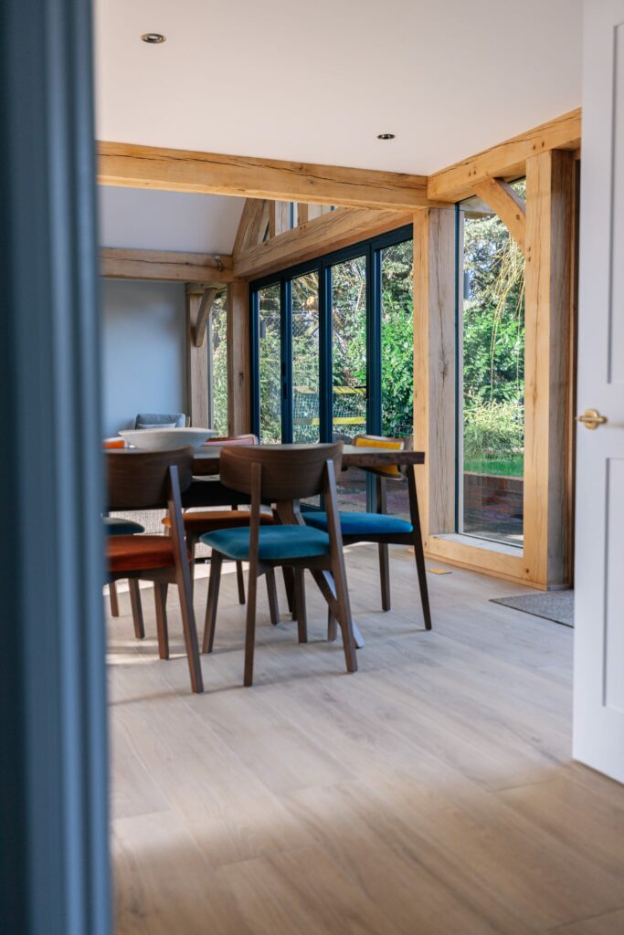 SERENITY-WHEAT. Image shows light oak tile in dining area with table and chairs