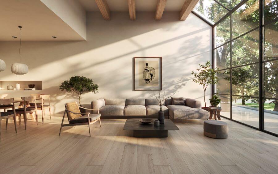 Image shows maple wooden effect tiles in lounge with sofa, table and chair