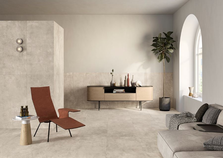 Image shows Minima Mist grey concrete look tile on floor and walls in lounge