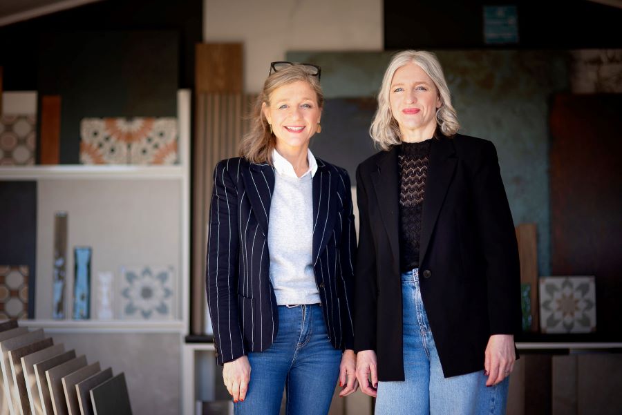 JO-RACH-SHOWROOM. Image shows 2 people standing in a tile showroom