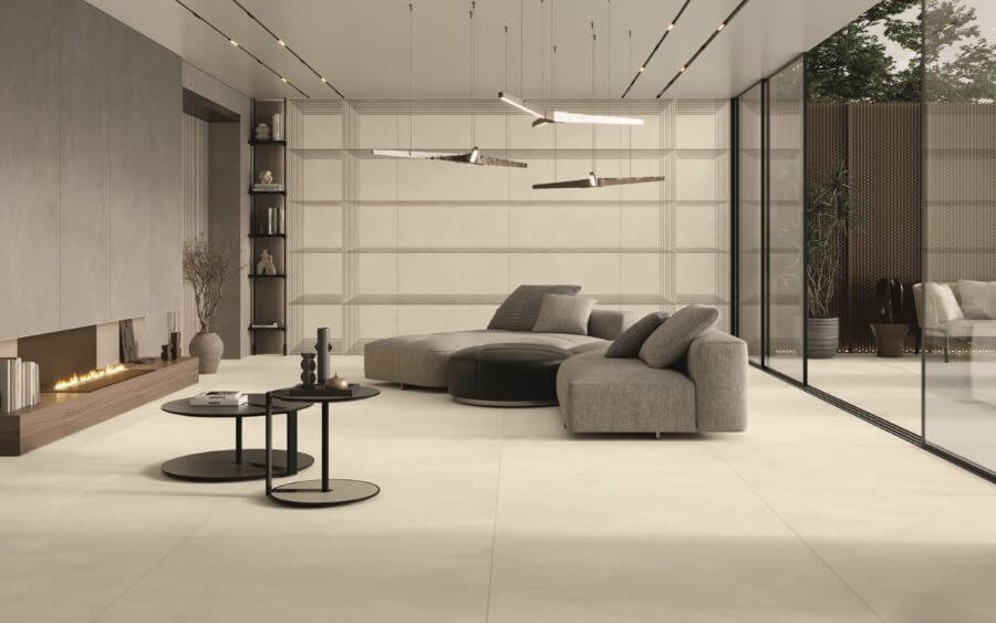 MODERN-FLOOR-TILES-FOR-LIVING-ROOM-AREAS-BLEND-MATCHSTICK. Image shows cream large format porcelain tiles in lounge with sofa and table