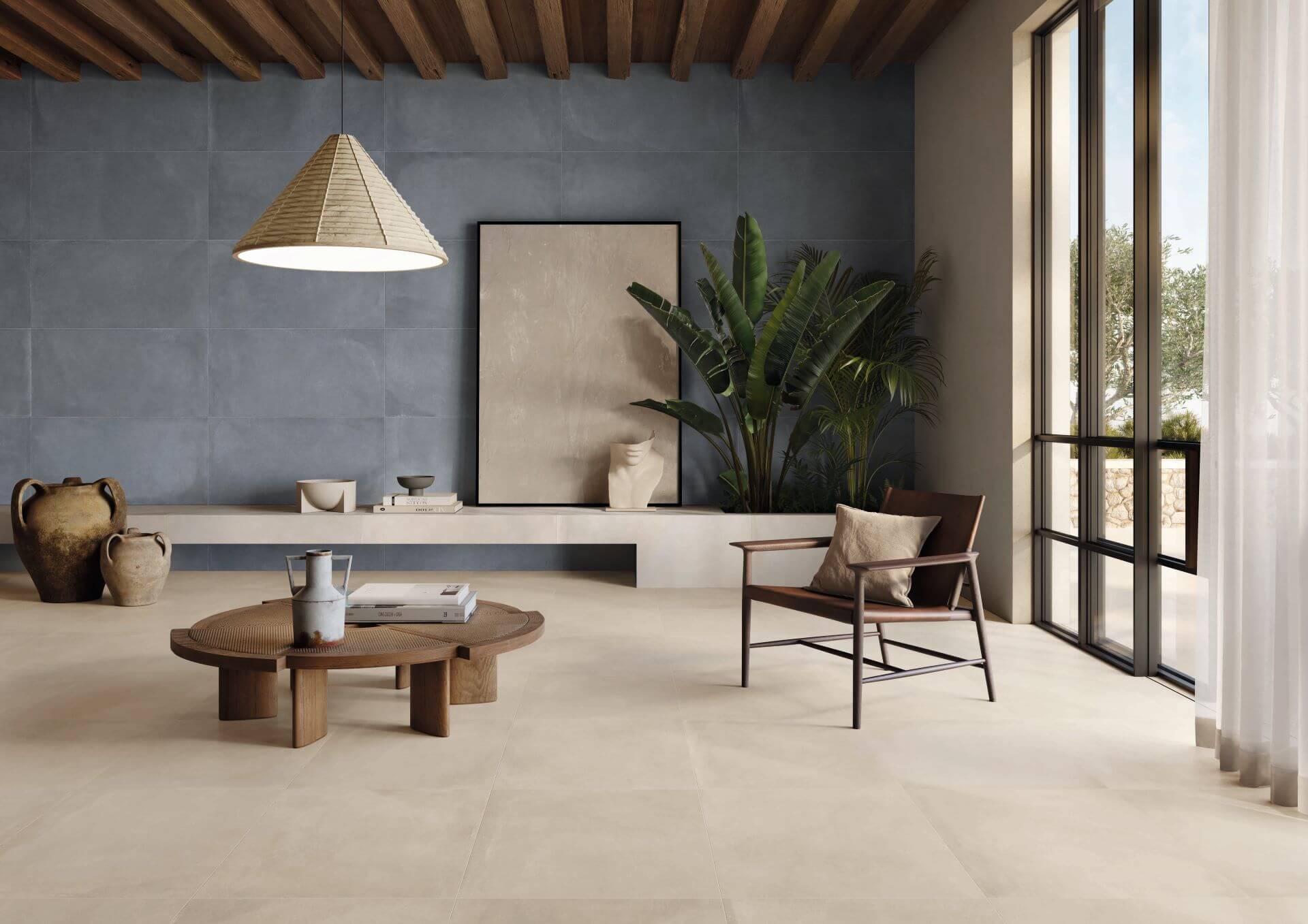 MODERN-FLOOR-TILES-FOR-LIVING-ROOM-TONE-ECRU. Image shows ecru tiles to floor of lounge with chair and table.