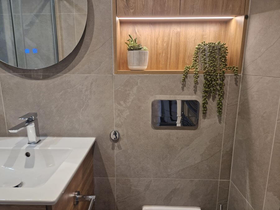 Image shows Aspect Ash tiles in bathroom above sink unit